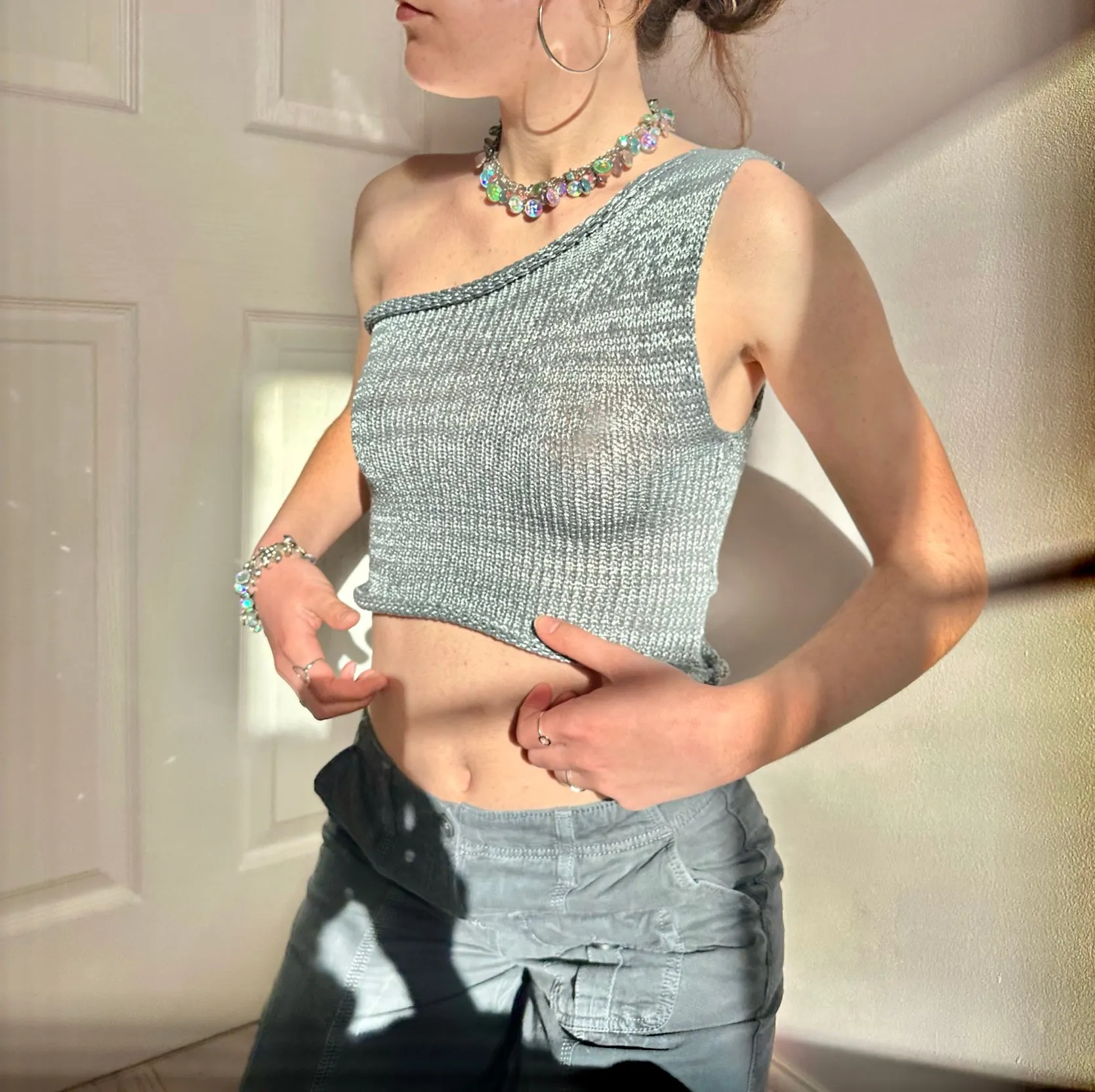 Handmade knitted metallic asymmetrical one shoulder top in silver and grey