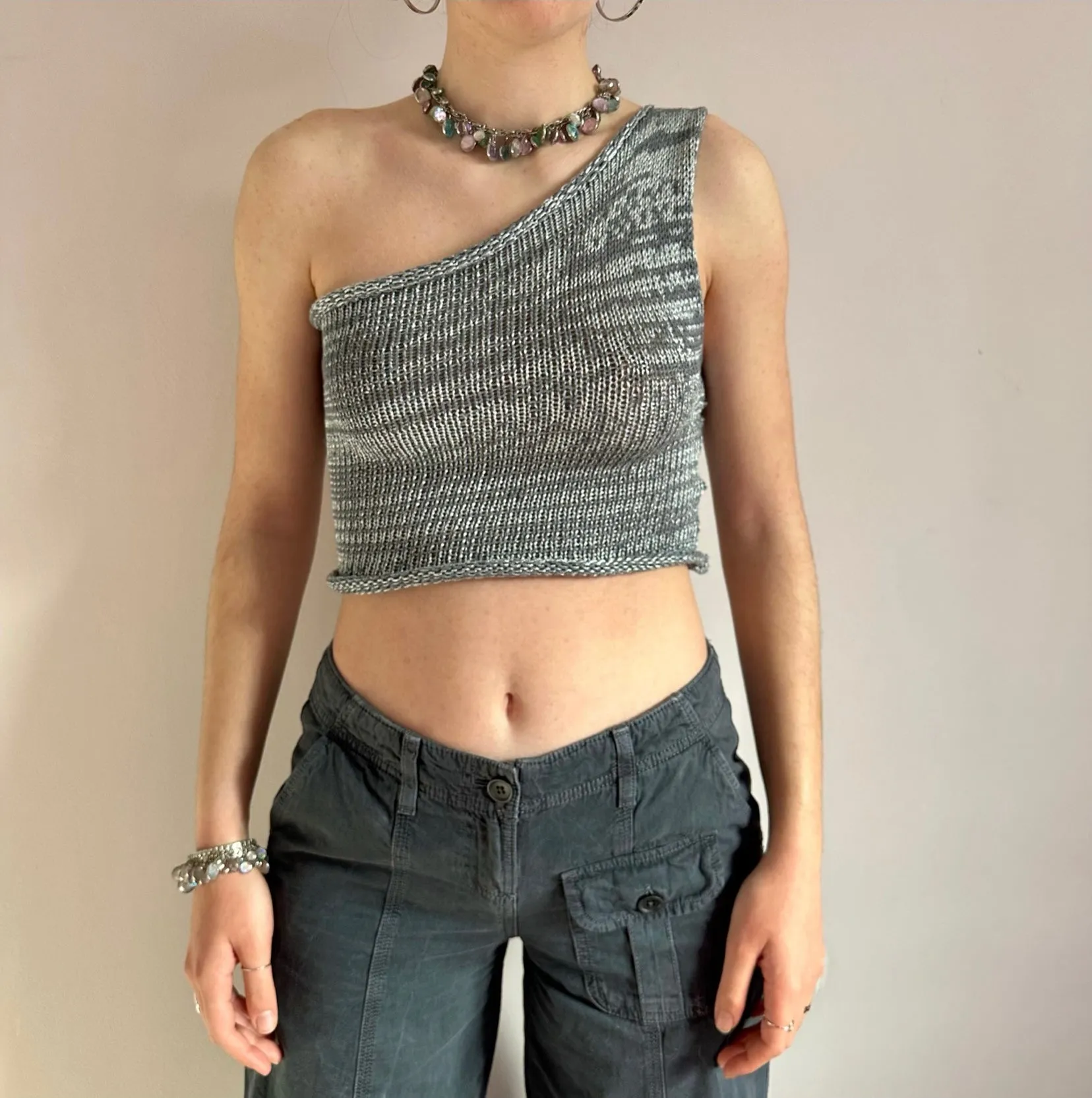 Handmade knitted metallic asymmetrical one shoulder top in silver and grey
